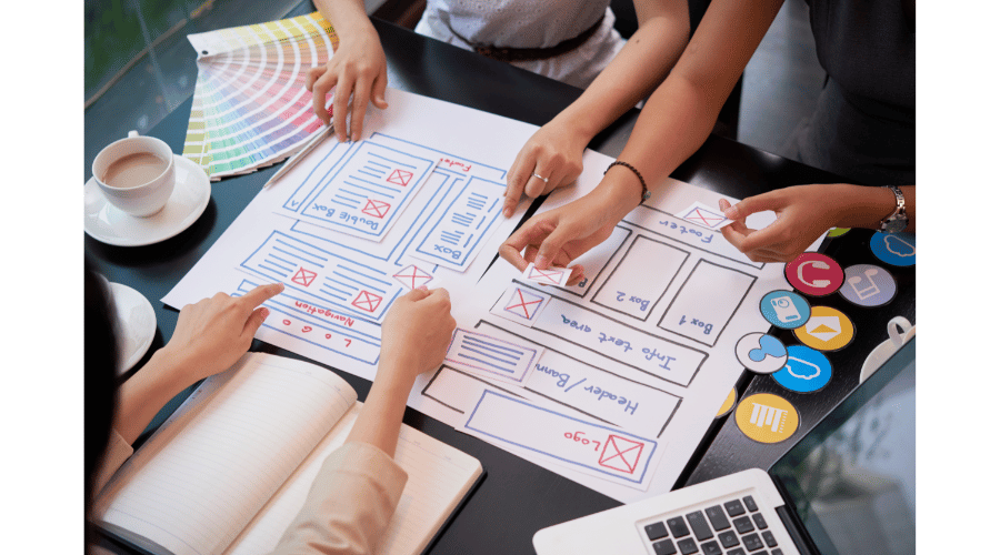Photo of a team working on a small website structure with fewer pages, highlighting simplicity and affordability in SEO audits